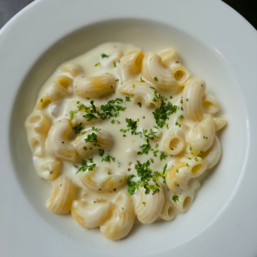 Golden baked mac and cheese with a crisp cheese top