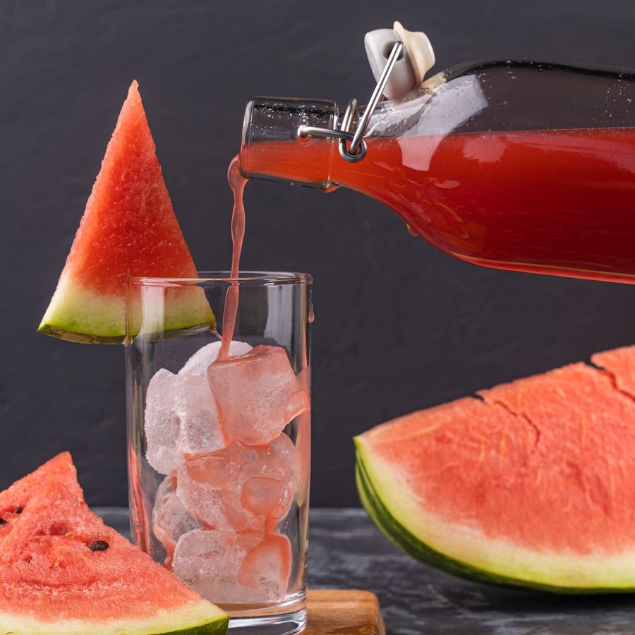 Tall glass of watermelon lemonade over ice